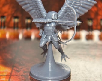 May include: A gray 3D printed miniature of an angel with wings outstretched, holding a bow and arrow. The angel is standing on a round base.