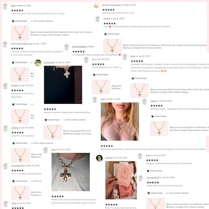 May include: Gold-toned cross pendant necklace with a chunky chain. The cross has a hammered texture, and the necklace is displayed with customer reviews. The necklace is a vintage-inspired piece.