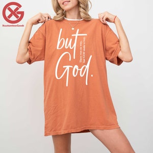 a woman wearing a t - shirt that says, but god