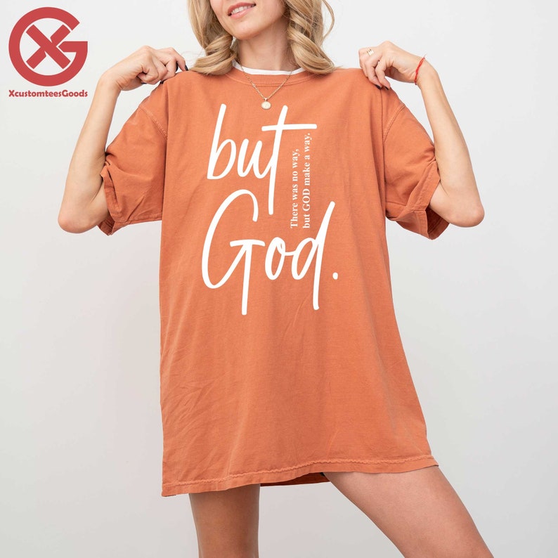 a woman wearing a t - shirt that says, but god