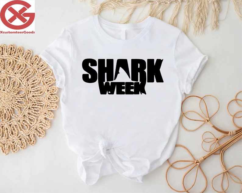 a white shirt with the words shark week on it
