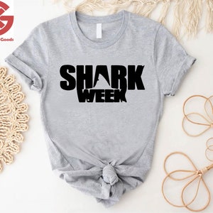 a t - shirt with the words shark week on it