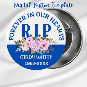 May include: A white button with blue trim features a floral design and the text "Forever in our hearts RIP Cindy White 1952-XXXX".