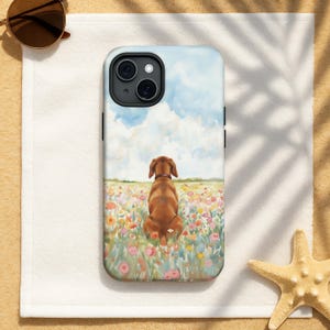 May include: A phone case featuring a watercolor painting of a dog sitting in a field of colorful flowers. The sky is blue with fluffy white clouds. The dog is brown with a dark brown collar.
