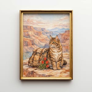 May include: Watercolor painting of a cat sitting on a rock ledge with a backpack and red flowers, overlooking a canyon landscape. The artwork is framed in a gold-colored frame.