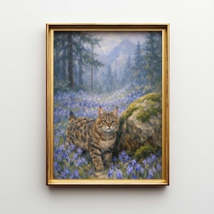 May include: A framed painting of a cat in a forest setting. The cat has brown and black markings and is surrounded by blue flowers. The background features trees and mountains, with a gold-colored frame.