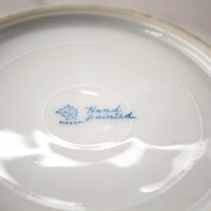 Nippon mark on bottom of pink flowered butter dish