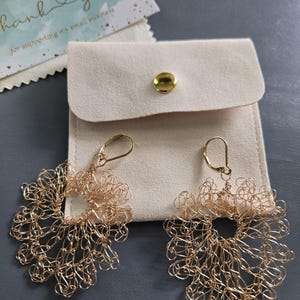 Elegant earrings resembling lace, hand crocheted by me.   Dangling from 24 kt goldplated lever back ear wires. Lovely! One of a kind!!