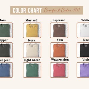 May include: A color chart for Comfort Color 1717 t-shirts displaying twelve folded shirts in various colors: Moss, Mustard, Espresso, White, Pepper, Ivory, Yam, Black, Blue Jean, Light Green, Watermelon, and Violet, each labeled with its name.