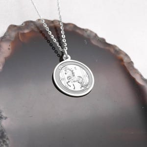 14k white gold horse zodiac necklace angle view focusing on the clean circular frame and polished back side, designed for personalization and everyday wear. The Year of the Horse symbolizes freedom, passion, and forward movement in Chinese astrology, making it a powerful talisman. SEO phrases: engraving necklace, chinese zodiac charm, horse pendant, lunar new year jewelry, astrology necklace, white gold medallion, handcrafted fine jewelry gift.
