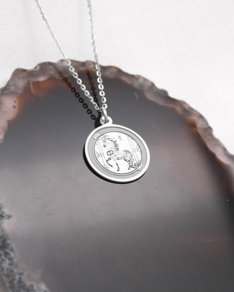 14k white gold horse zodiac necklace angle view focusing on the clean circular frame and polished back side, designed for personalization and everyday wear. The Year of the Horse symbolizes freedom, passion, and forward movement in Chinese astrology, making it a powerful talisman. SEO phrases: engraving necklace, chinese zodiac charm, horse pendant, lunar new year jewelry, astrology necklace, white gold medallion, handcrafted fine jewelry gift.
