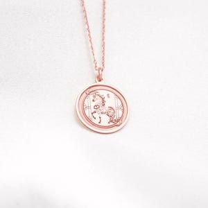 14k rose gold Year of the Horse necklace shown in a clean product photo, featuring the same Chinese zodiac horse engraving in a warm rose tone. The Horse represents freedom, ambition, and forward movement in Chinese astrology, making this a meaningful Lunar New Year or birthday gift. SEO: rose gold horse necklace, chinese zodiac pendant, lunar new year jewelry, astrology charm, medallion necklace, personalized engraving option.