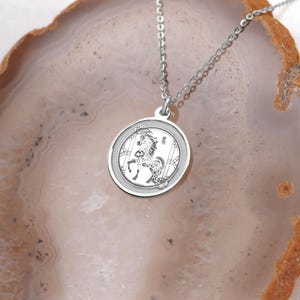 Close-up product photo of a 14k white gold Chinese zodiac Horse medallion necklace, highlighting the polished rim, fine chain, and crisp engraving detail. Inspired by Year of the Horse meaning—confidence, ambition, and unstoppable momentum—this piece suits minimalist styling and layering. Search terms: white gold horse pendant, lunar new year jewelry, zodiac necklace, astrology charm, chinese new year gift, personalized engraving necklace, handmade fine jewelry.