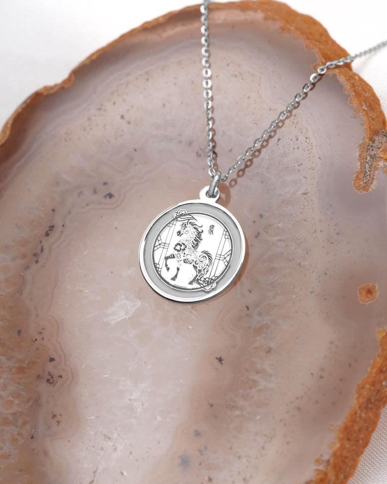 Close-up product photo of a 14k white gold Chinese zodiac Horse medallion necklace, highlighting the polished rim, fine chain, and crisp engraving detail. Inspired by Year of the Horse meaning—confidence, ambition, and unstoppable momentum—this piece suits minimalist styling and layering. Search terms: white gold horse pendant, lunar new year jewelry, zodiac necklace, astrology charm, chinese new year gift, personalized engraving necklace, handmade fine jewelry.