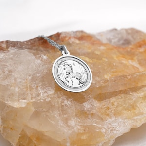925 sterling silver option photo of the Year of the Horse coin pendant necklace, showing the same engraved horse motif and smooth circular frame in bright silver. Great for everyday wear, layering, and gifting for Lunar New Year or Chinese zodiac birthdays. Search terms: silver horse necklace, Chinese zodiac charm, year of the horse pendant, astrology jewelry. Handmade finish with clean details and a refined minimalist look.