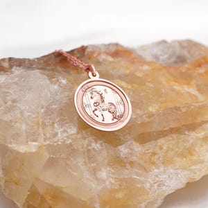 Gift-ready presentation of the 14k solid gold Chinese zodiac Horse medallion necklace, arranged with a clean minimal aesthetic to show scale and shine. The Year of the Horse meaning—confidence, vitality, and fearless movement—makes it a memorable Lunar New Year or birthday gift. SEO phrases: horse pendant necklace, zodiac jewelry, chinese new year gift, astrology necklace, solid gold medallion, personalized engraving charm.