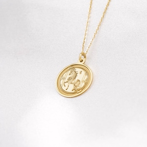 14k solid gold Horse zodiac necklace styled in a bright flatlay, showcasing the round coin pendant centered on a delicate chain. The Chinese zodiac Horse stands for freedom, ambition, and energetic new beginnings—perfect for Lunar New Year celebrations and meaningful gifting. Search phrases: year of the horse necklace, chinese new year jewelry, zodiac pendant, gold medallion necklace, minimalist charm, handmade engraving-ready piece.