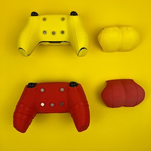 May include: Two sets of controller skins for a gaming console. One set is yellow and the other is red. Each set includes a skin for the controller and two thumbstick covers.