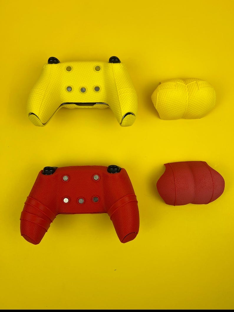 May include: Two sets of controller skins for a gaming console. One set is yellow and the other is red. Each set includes a skin for the controller and two thumbstick covers.