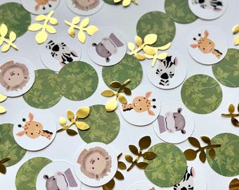 May include: A collection of confetti featuring various animal illustrations, including giraffes, zebras, lions, hippos, and leaves. The confetti is printed on white circles with a green leafy background.