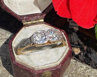 Stunning antique diamond ring featuring two old European cut diamonds