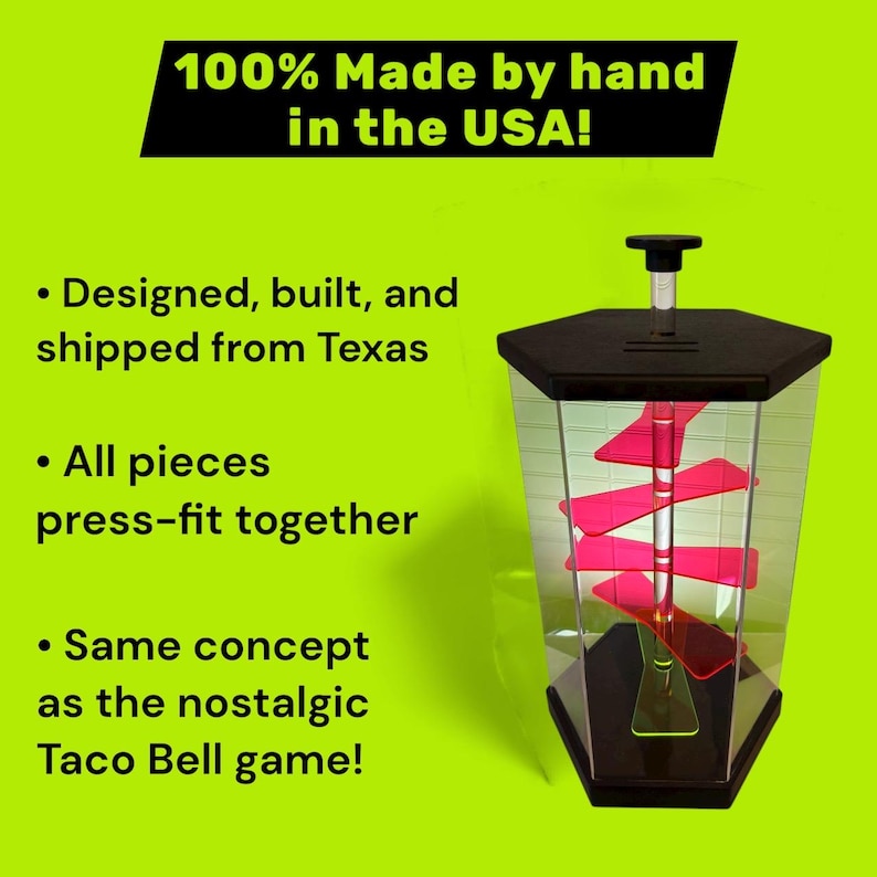 Puede incluir: Un juego hexagonal transparente con tapa y base negras, con una espiral roja en el interior. El texto dice "100% Made by hand in the USA!" y "Designed, built, and shipped from Texas." Es un concepto de juego nost&aacute;lgico.