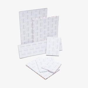 May include: An assortment of Post-it note pads in various sizes. The pads are white with a repeating pattern of the Post-it logo. The pads are arranged in a layered composition, showcasing the different sizes available for office or home use.