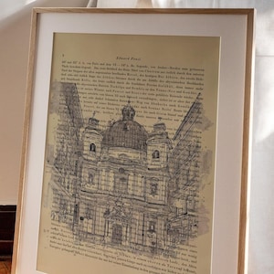 Könnte beinhalten: Ein gerahmter Druck einer Schwarzweißillustration eines Gebäudes mit einer Kuppel. Die Illustration ist auf einer Seite aus einem alten Buch gedruckt. Der Text auf der Seite ist in deutscher Sprache und lautet "Eduard Fuchs".