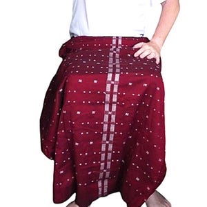 May include: A maroon skirt with a white geometric pattern. The skirt is made of a soft, woven fabric.