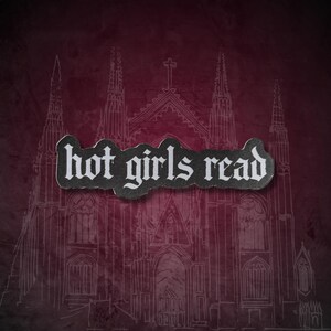 May include: A dark red background with a white line drawing of a cathedral. A black and white sticker with the words "hot girls read" is placed over the cathedral image.