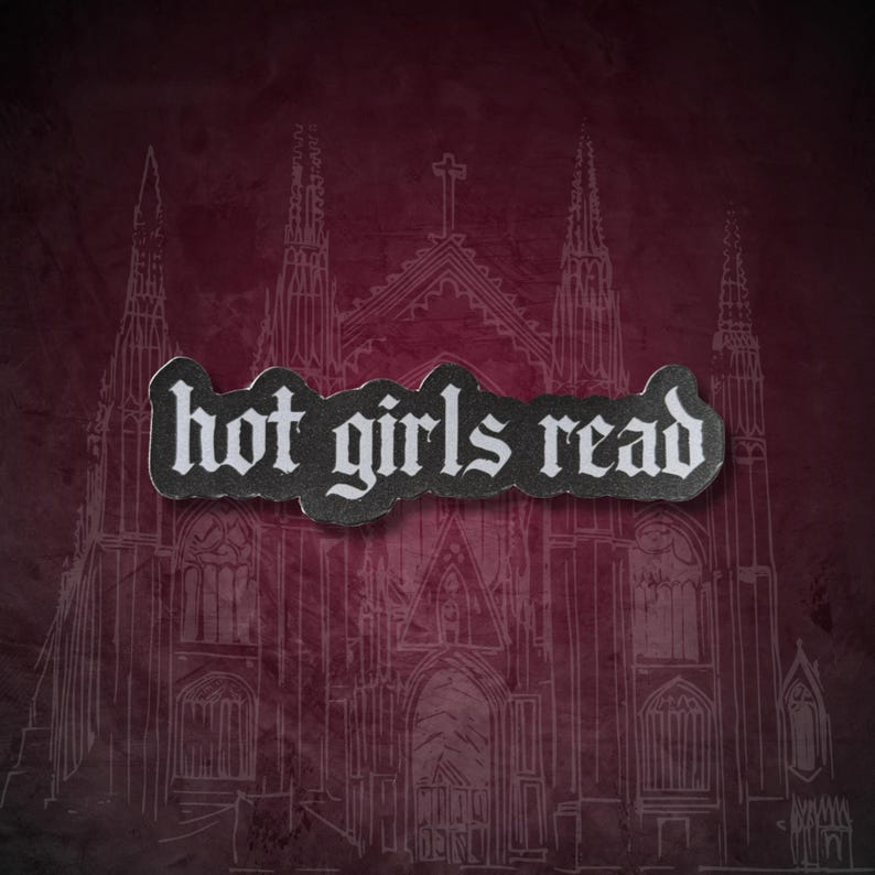 May include: A dark red background with a white line drawing of a cathedral. A black and white sticker with the words "hot girls read" is placed over the cathedral image.