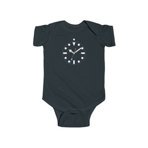 May include: A dark blue baby onesie with a white clock face graphic. The clock face has white hands and black markings.
