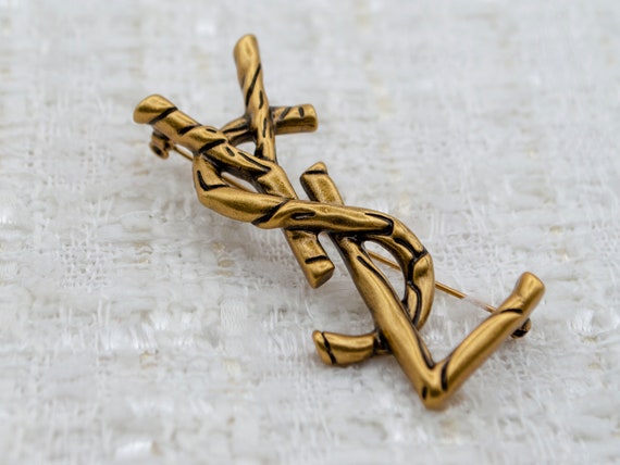 ゴールド SAINT LAURENT YSL メタル ブローチ ゴールド SAINT LAURENT YSL メタルブローチ