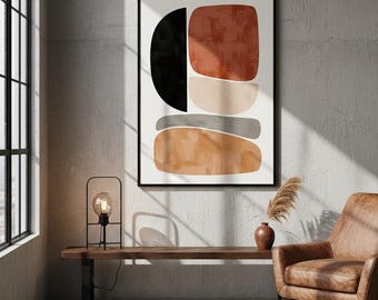 Puede incluir: Impresión artística abstracta con formas geométricas en negro, óxido, beige y gris. La obra de arte está enmarcada en negro y cuelga de una pared de hormigón. Una lámpara moderna, un banco de madera y un sillón de cuero completan el diseño.