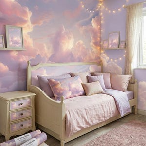 May include: A bedroom scene with a cloudscape mural in shades of pink and purple. A bed with matching bedding and pillows is in front of the mural. A nightstand and small table are also in the room, along with a pink rug and string lights.