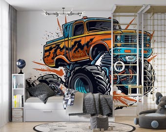 May include: A cartoon monster truck with orange, blue, and black paint, with flames on the side, is on a white wall. The truck has large tires and a black grill. The truck is in a child's bedroom with a white bed and a gray elephant stuffed animal.