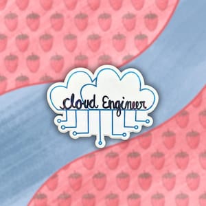 May include: A white sticker with a blue holographic finish depicting a cloud with the text "cloud engineer" and a stylised circuit board design.