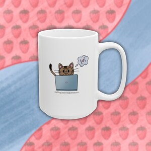 May include: White ceramic mug featuring a brown cat wearing glasses and a thought bubble with a heart inside. The cat is sitting in front of a laptop with the text "coding meowgorithms".