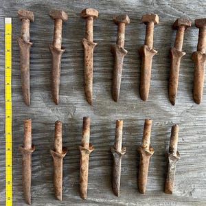 May include: A set of three ceramic mugs with a speckled, matte finish. The mugs are in shades of cream, light gray, and dark gray. Each mug has a simple, minimalist design, perfect for coffee or tea.