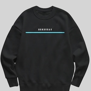 May include: Black sweatshirt with the word "HONDURAS" in white capital letters above a horizontal turquoise line. The sweatshirt is a solid black color and has a crew neck.