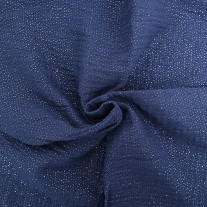 May include: A close-up of a navy blue fabric with a subtle shimmer of silver glitter. The fabric is soft and textured, with a slightly crinkled appearance.