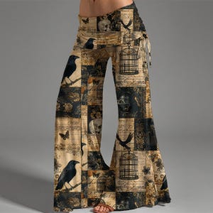 May include: Wide-leg pants featuring a beige and black collage print. The pattern includes illustrations of black crows, birdcages, skulls, butterflies, and vintage-style cursive script text arranged in a patchwork layout with a fold-over waistband.