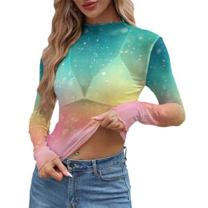 May include: A sheer, long-sleeved top with a mock neck and a colorful gradient design. The colors transition from blue to yellow to pink, with white speckles. The sleeves have a ruffled edge.