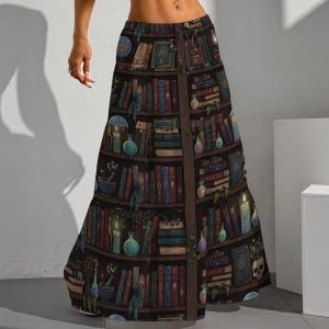 May include: A long, flowing skirt featuring a detailed print of a bookshelf filled with books, candles, and potion bottles. The design incorporates dark browns, blues, and greens, creating a mystical and enchanting aesthetic. The skirt has a wide, flared silhouette.