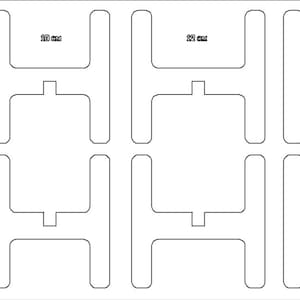 May include: A sheet of white paper with eight cut-out shapes. Each shape is a 100 mm square with a smaller square cut out of the center. The smaller square is 25 mm wide.