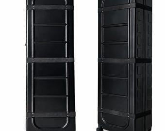 May include: A tall, rectangular black hard-shell travel case with a smooth finish and reinforced horizontal bands. The case features a structured design with molded panels, a vertical orientation, and four small swivel wheels at the base.