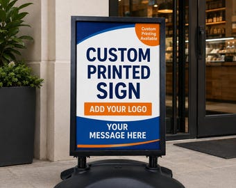 May include: A black, double-sided sidewalk sign with the text "CUSTOM PRINTED SIGN" in large white letters. The sign includes space to "ADD YOUR LOGO" and "YOUR MESSAGE HERE". A small orange circle in the corner says "Custom Printing Available".