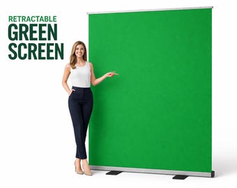 May include: A retractable green screen with the text "RETRACTABLE GREEN SCREEN" in dark green. A woman in a white tank top and navy blue pants stands next to the screen, pointing at it. The screen is mounted on a silver frame.
