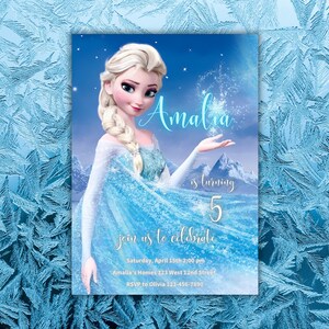 May include: A Frozen-themed birthday invitation featuring a blue and white illustration of Elsa from the movie Frozen. The invitation says "Amalia is turning 5" and includes details for the party, including the date, time, location, and RSVP information.