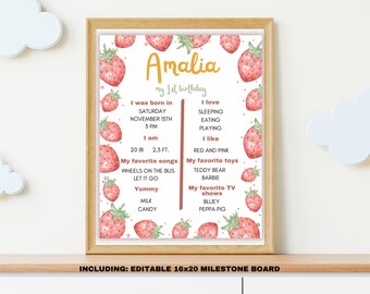 May include: A printable 16x20 inch milestone board with a strawberry theme. The board is decorated with pink and green watercolor strawberries. The text on the board reads "Amalia my 1st birthday". The board includes information about the child's birthdate, weight, height, favorite songs, toys, and TV shows.